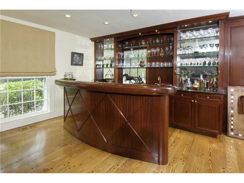 22 Perkins Road Greenwich, CT 06830 - Photo 7 of 16 a kitchen with a sink and wooden cabinets
