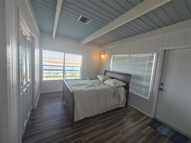 a view of a livingroom with wooden floor