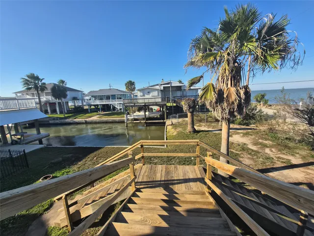 a view of a swimming pool with a table and chairs