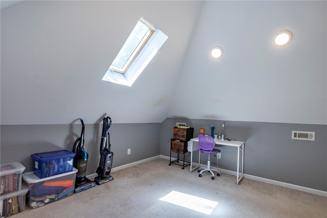 151 Hannah Circle Anderson, SC 29621 - Photo 27 of 46 This cozy attic room features a sloped ceiling and a skylight, creating a bright and airy atmosphere.