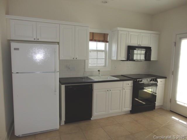 121 South Faulkner Way Davidson, NC 28036 - Photo 6 of 10 a kitchen with stainless steel appliances granite countertop a refrigerator and a sink