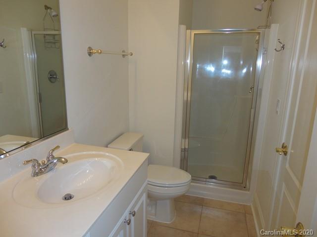 121 South Faulkner Way Davidson, NC 28036 - Photo 8 of 10 a bathroom with a sink toilet and shower
