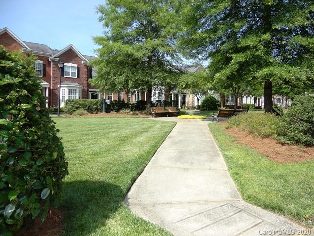 121 South Faulkner Way Davidson, NC 28036 - Photo 10 of 10 a front view of a house with a yard and trees