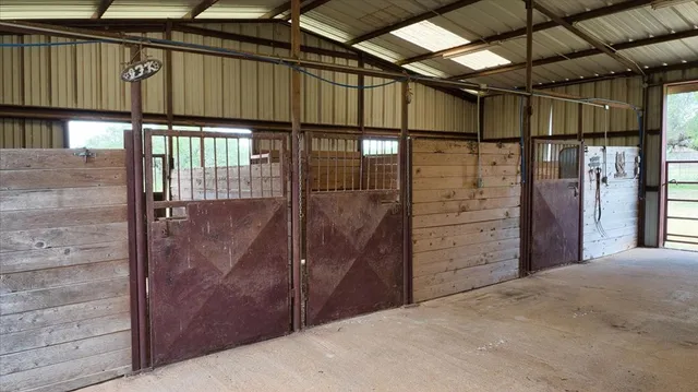 a backyard of a house with a yard and outdoor seating