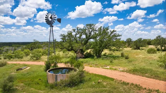 a view of a chairs and table in patio