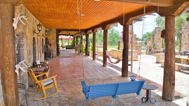 a outdoor living space with furniture and a fireplace