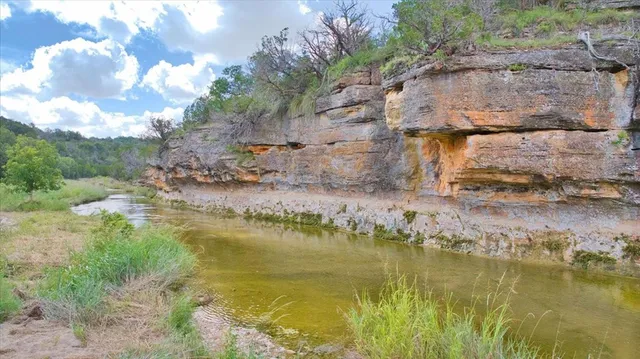 a view of an ocean with a building in the background