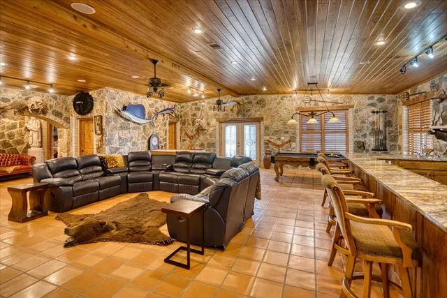 a backyard of a house with yard barbeque oven and outdoor seating