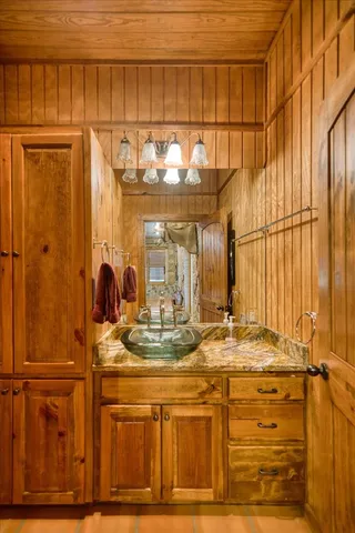 a bedroom with two beds and painted walls