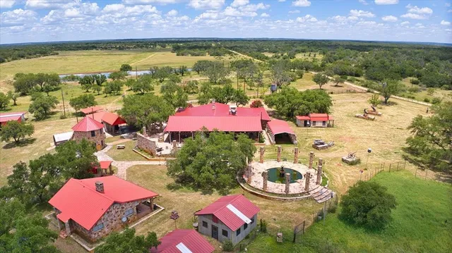 a view of a lake with houses in the back