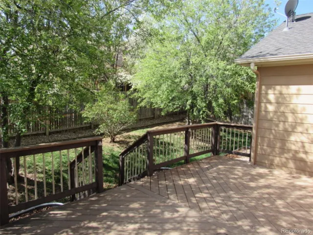 a view of a wooden deck with a bench