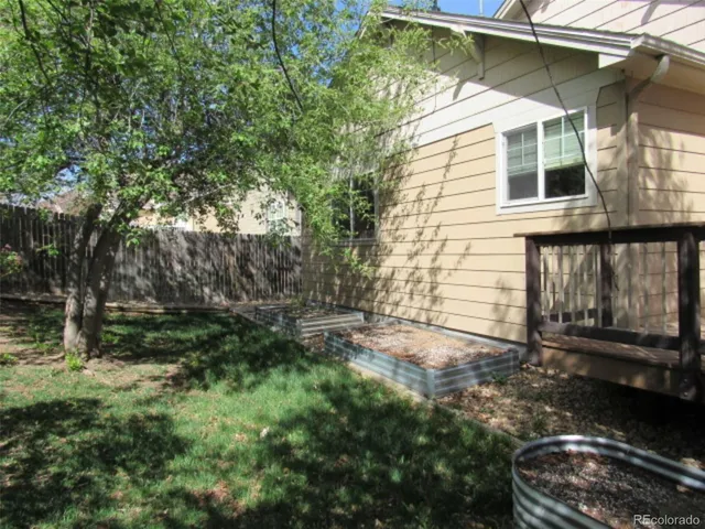 a table and chairs in front of a house