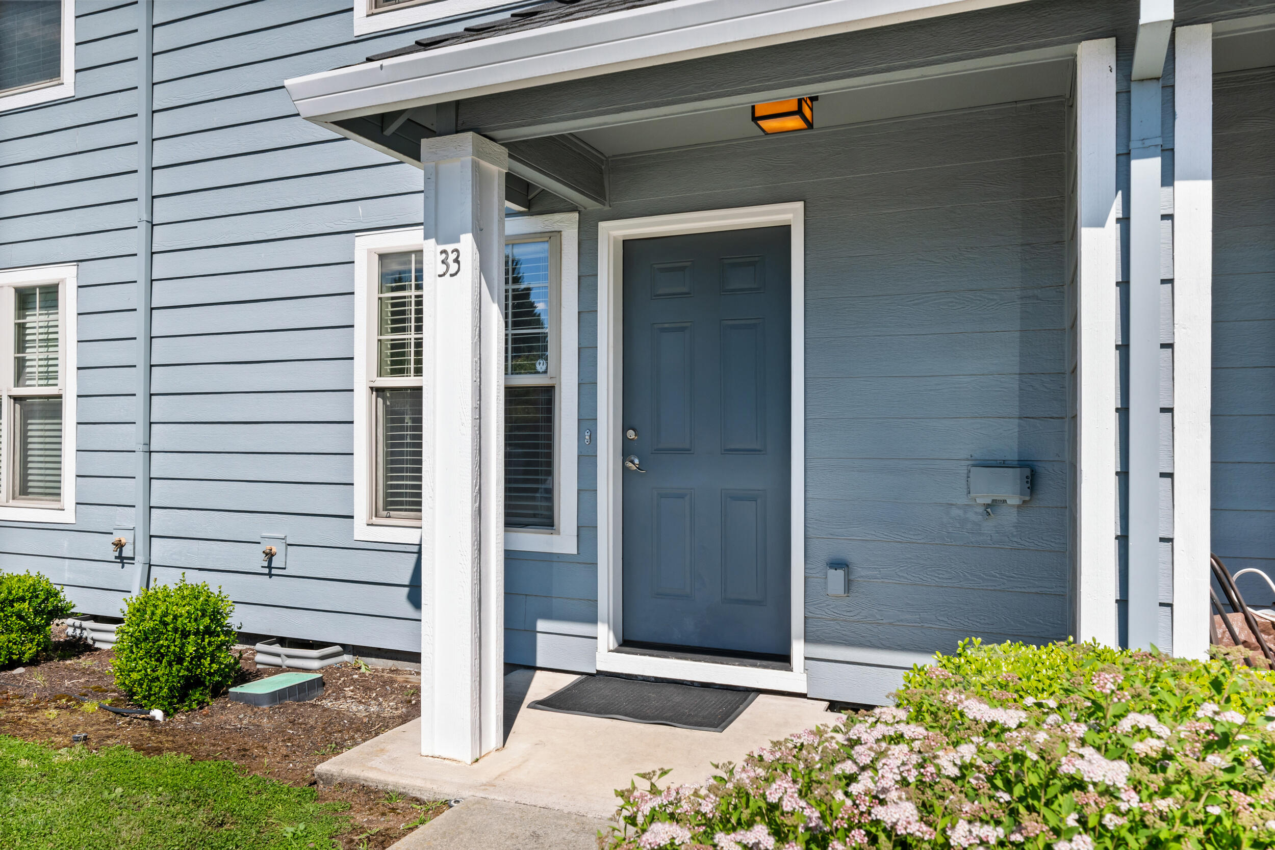 450 Midway Road, Unit 33 Medford, OR 97501 - Photo 4 of 21 a view of front door and potted plants