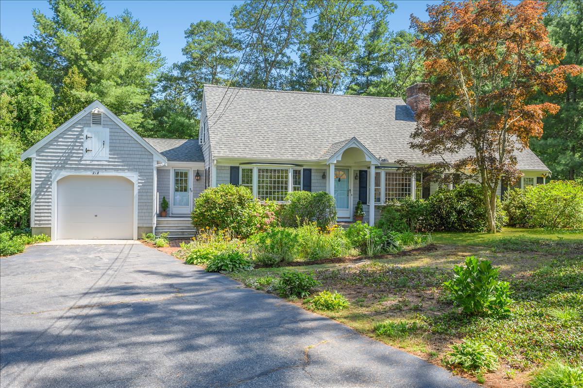 218 Hickory Hill Circle Osterville, MA 02655 - Photo 1 of 30 a front view of a house with a yard and potted plants