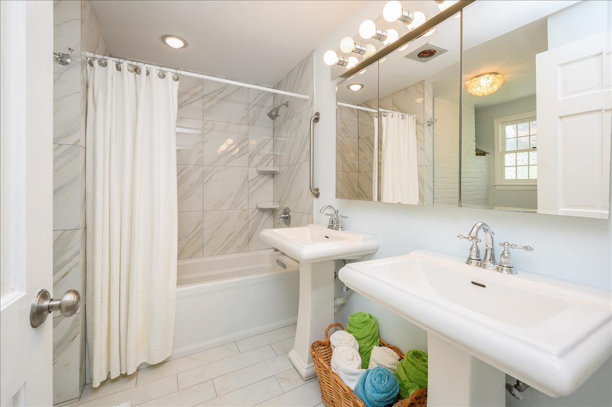 218 Hickory Hill Circle Osterville, MA 02655 - Photo 13 of 30 a bathroom with a sink mirror and a bathtub