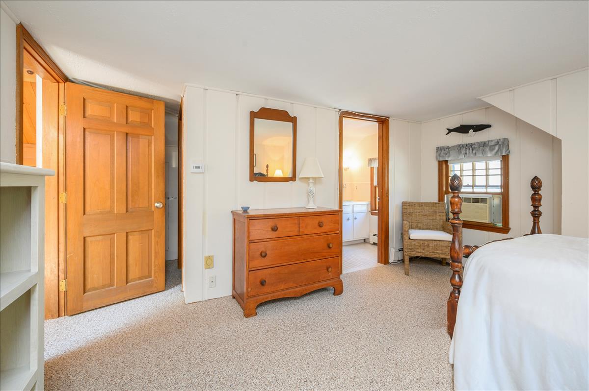 218 Hickory Hill Circle Osterville, MA 02655 - Photo 18 of 30 a bedroom with a bed and a dresser