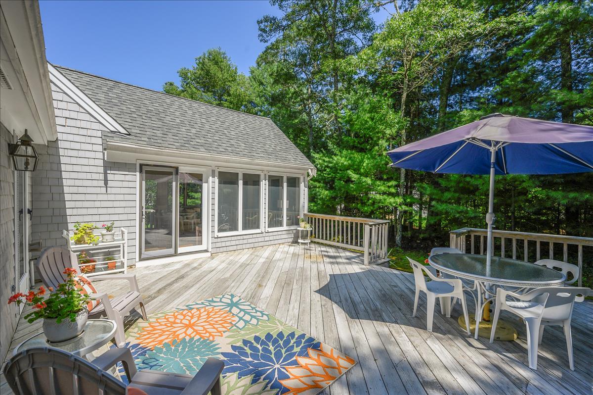 218 Hickory Hill Circle Osterville, MA 02655 - Photo 22 of 30 a view of balcony with outdoor seating and wooden floor