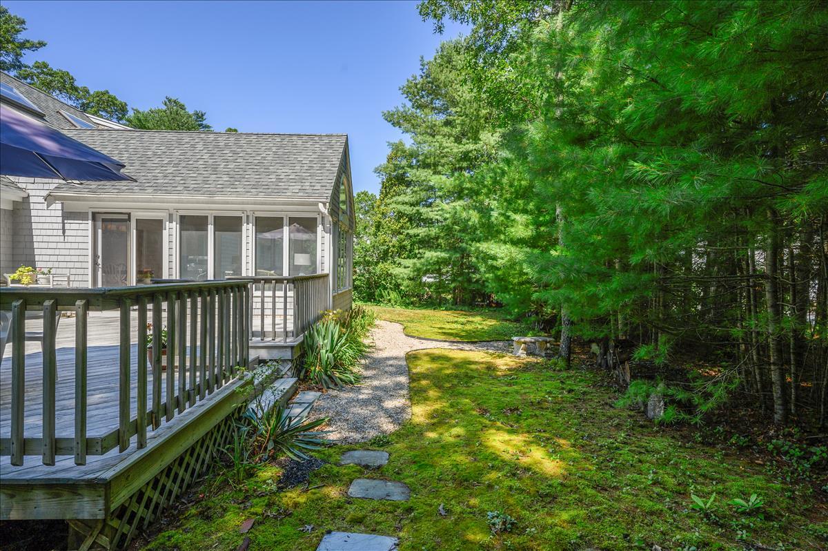 218 Hickory Hill Circle Osterville, MA 02655 - Photo 24 of 30 a view of a house with a yard and potted plants