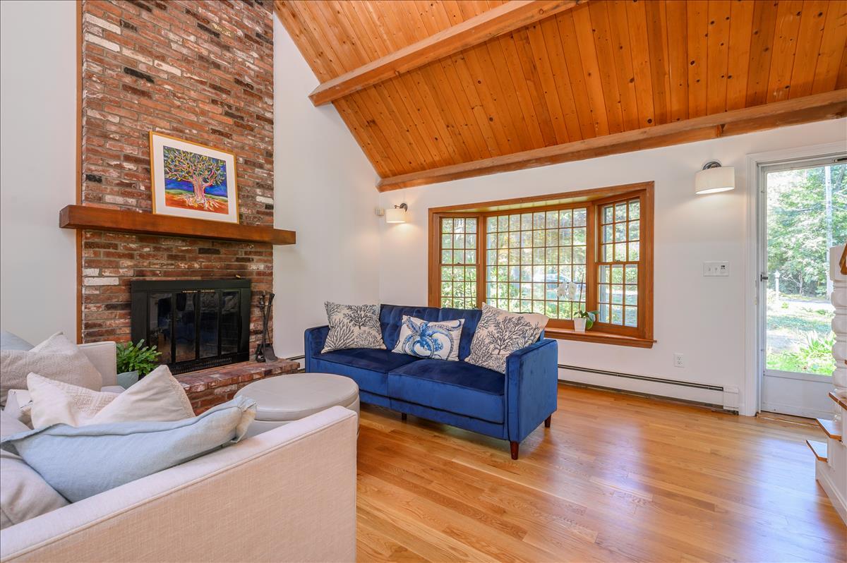 218 Hickory Hill Circle Osterville, MA 02655 - Photo 3 of 30 a living room with furniture and a fireplace
