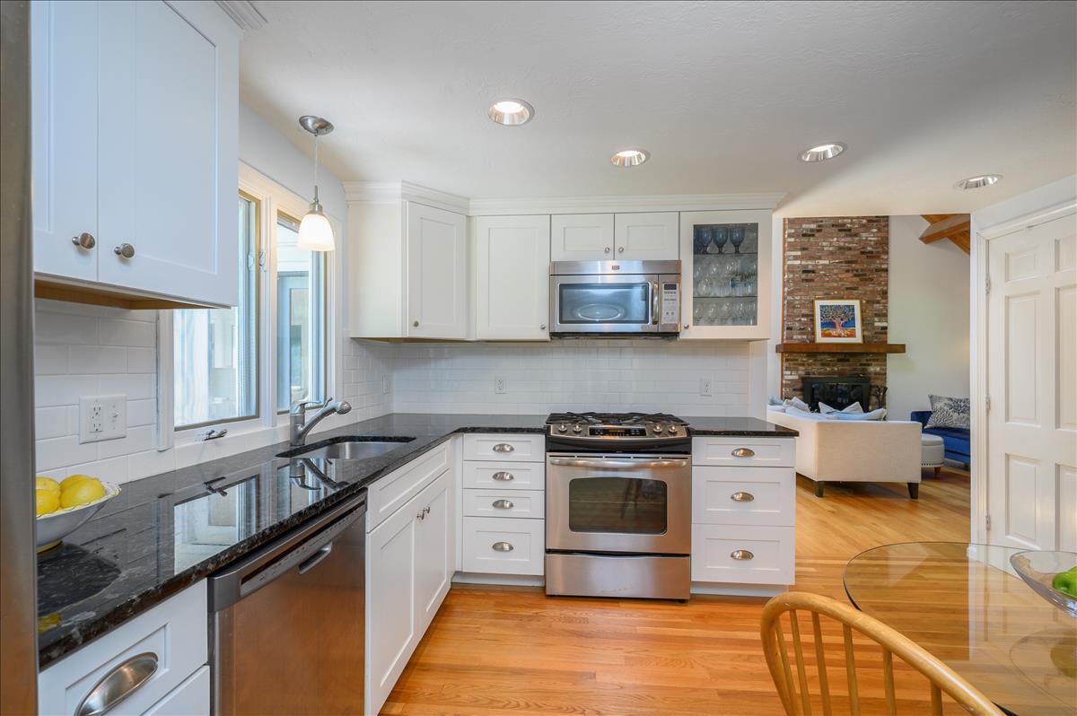 218 Hickory Hill Circle Osterville, MA 02655 - Photo 8 of 30 a kitchen with stainless steel appliances a stove a sink a stove and a microwave