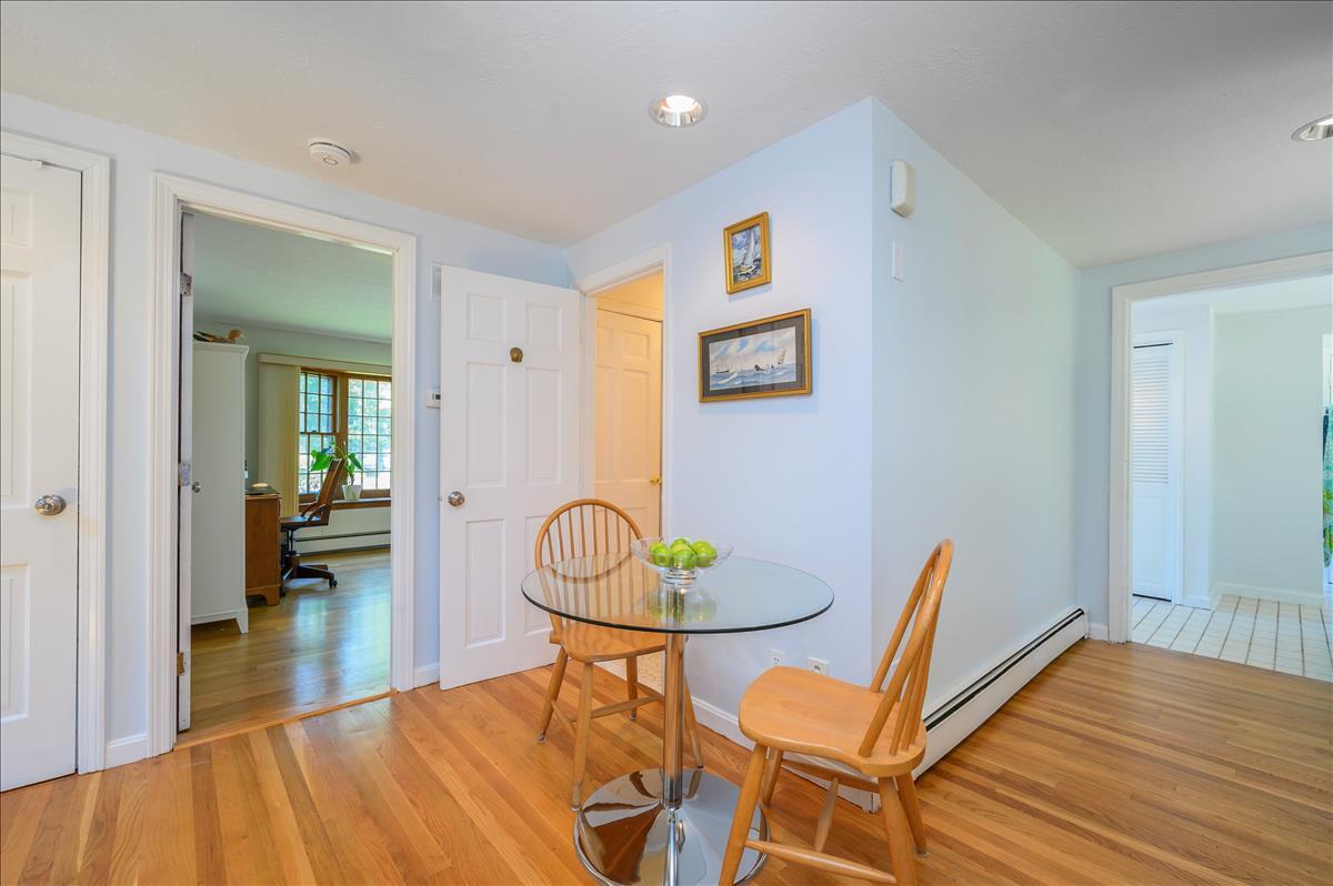 218 Hickory Hill Circle Osterville, MA 02655 - Photo 10 of 30 a view of a dining room with furniture and wooden floor