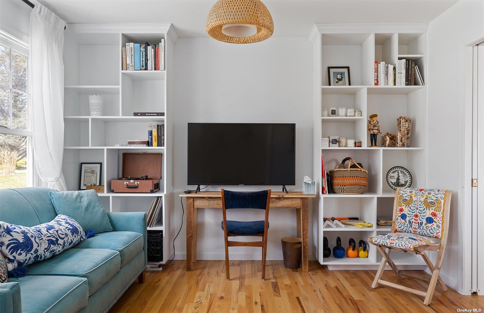 355 Midway Road Southold, NY 11971 - Photo 12 of 24 a living room with furniture and a wooden floor