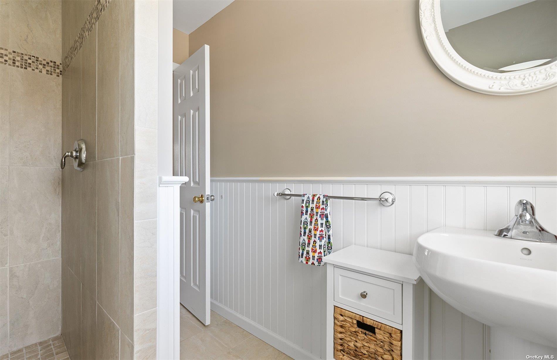 355 Midway Road Southold, NY 11971 - Photo 18 of 24 a bathroom with a sink and a vanity