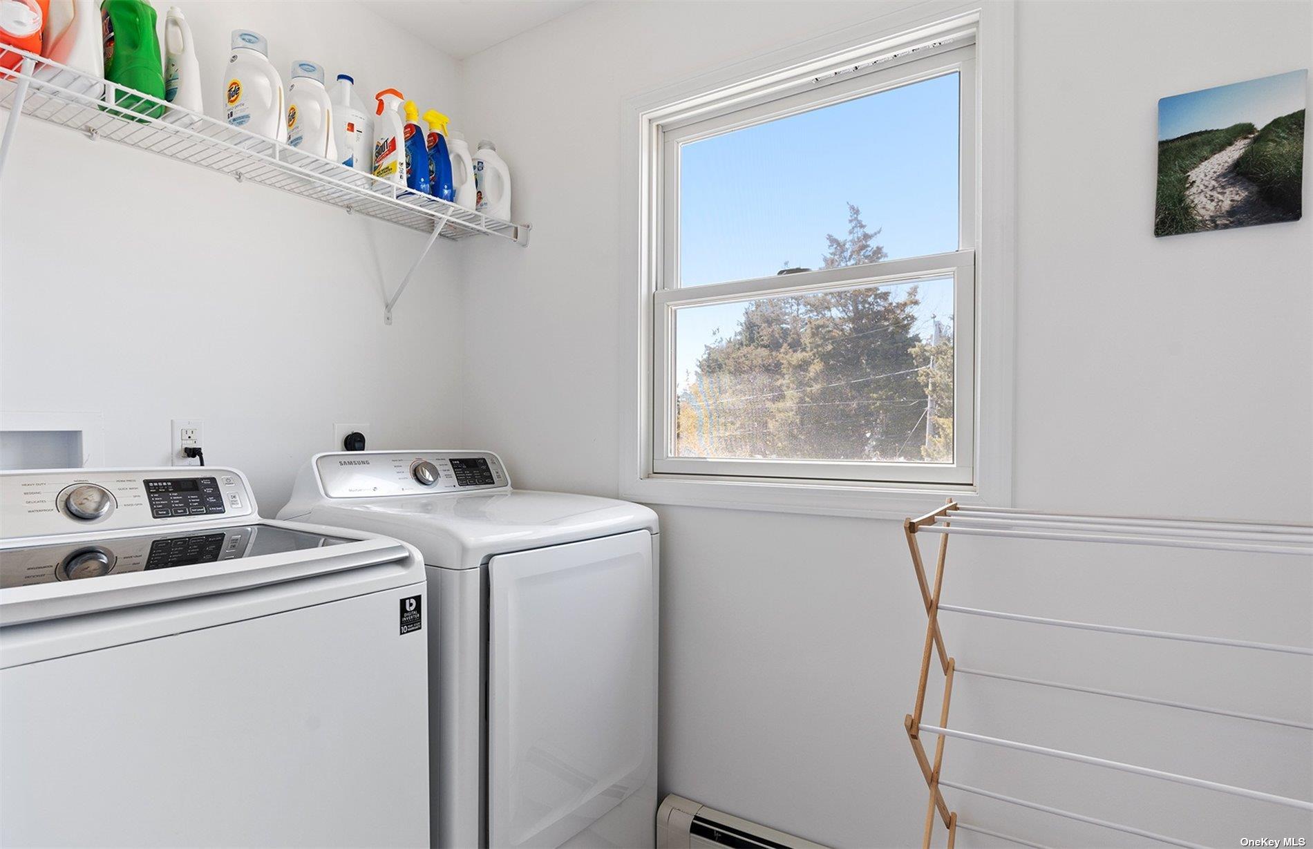 355 Midway Road Southold, NY 11971 - Photo 19 of 24 a view of storage and utility room with washer and dryer