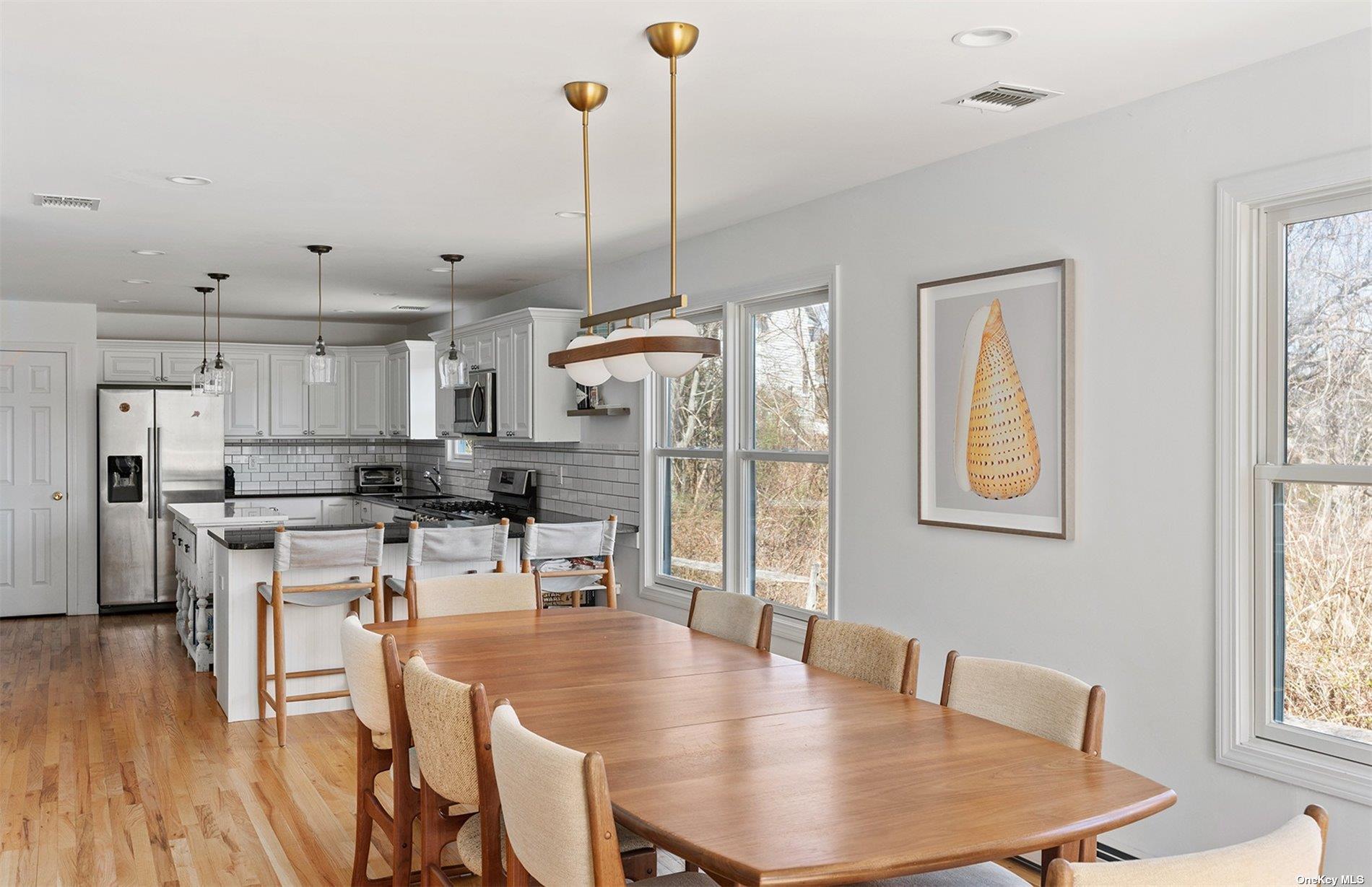 355 Midway Road Southold, NY 11971 - Photo 7 of 24 a view of kitchen and dining room