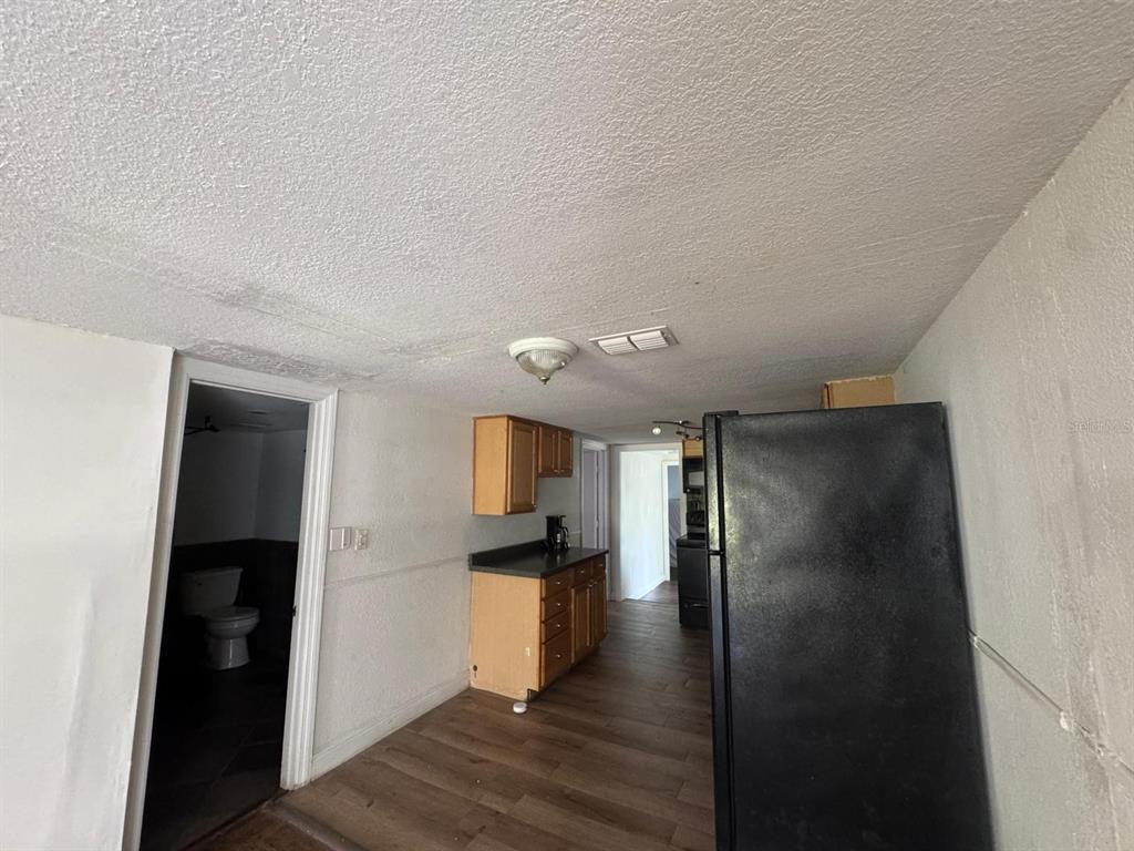 224 10th Avenue Ocoee, FL 34761 - Photo 6 of 14 a view of a refrigerator in kitchen and a window