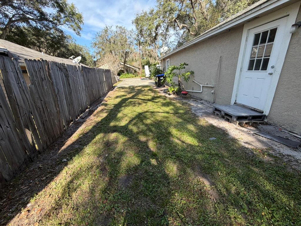 224 10th Avenue Ocoee, FL 34761 - Photo 8 of 14 a backyard of a house with table and chairs