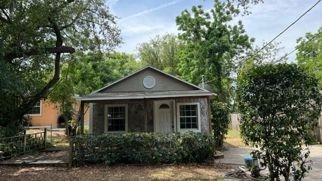 224 10th Avenue Ocoee, FL 34761 - Photo 9 of 14 a front view of a house with a garden