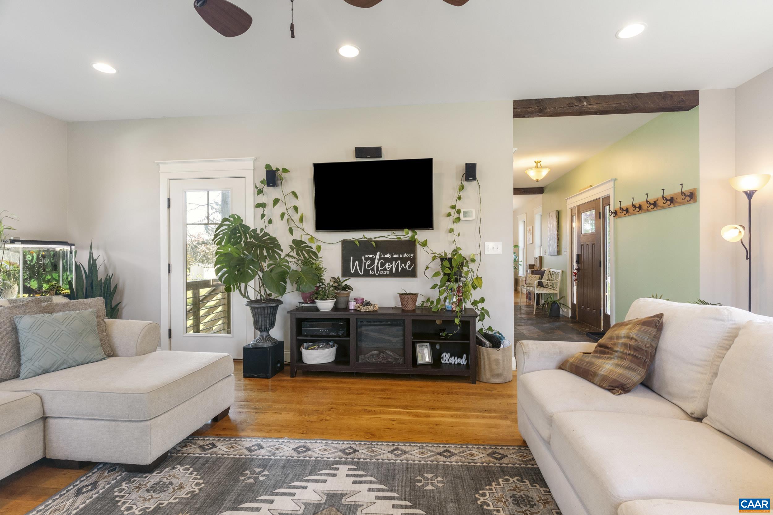 379 Crestview Drive Rustburg, VA 24588 - Photo 16 of 53 a living room with furniture and a flat screen tv