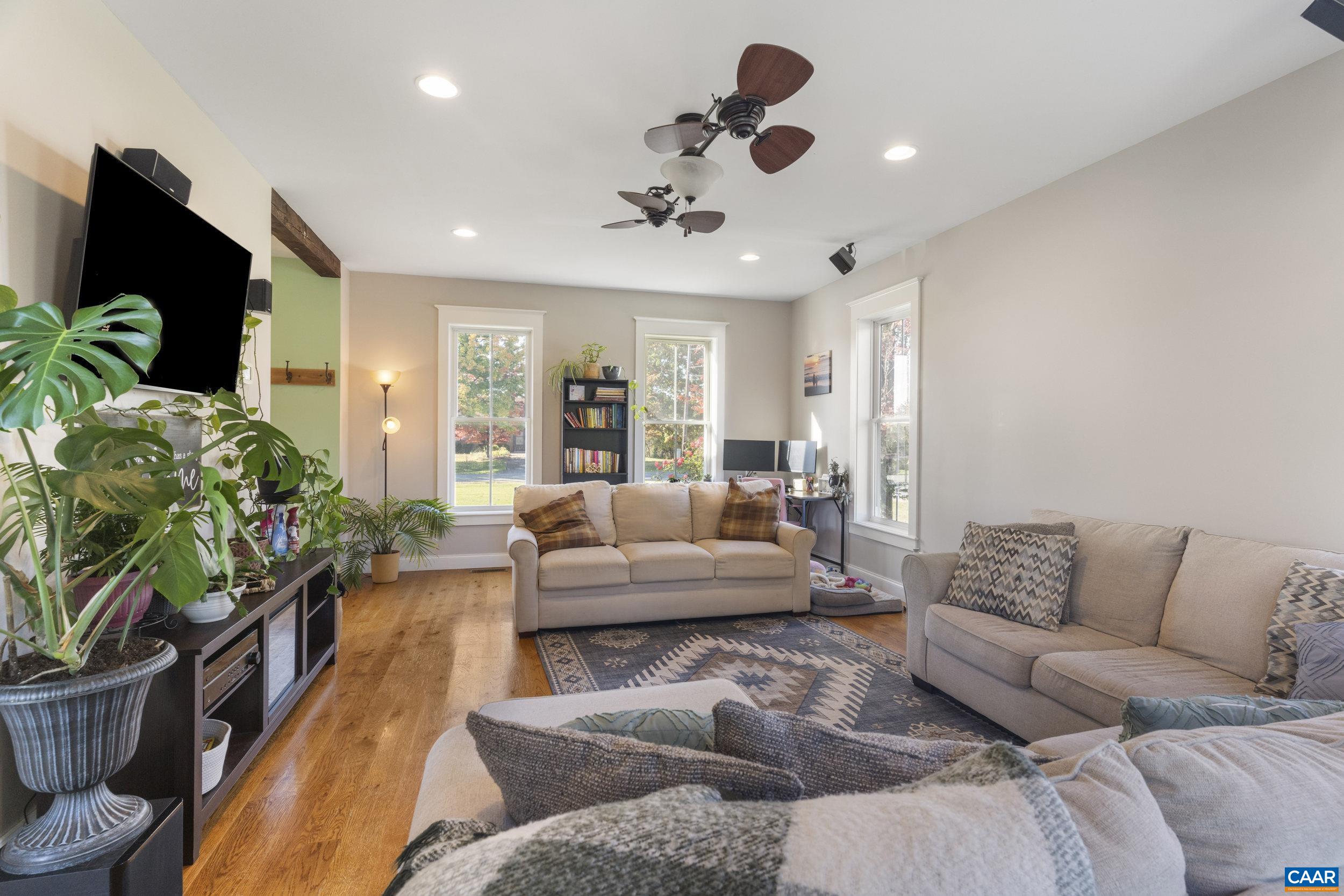379 Crestview Drive Rustburg, VA 24588 - Photo 17 of 53 a living room with furniture and a potted plant