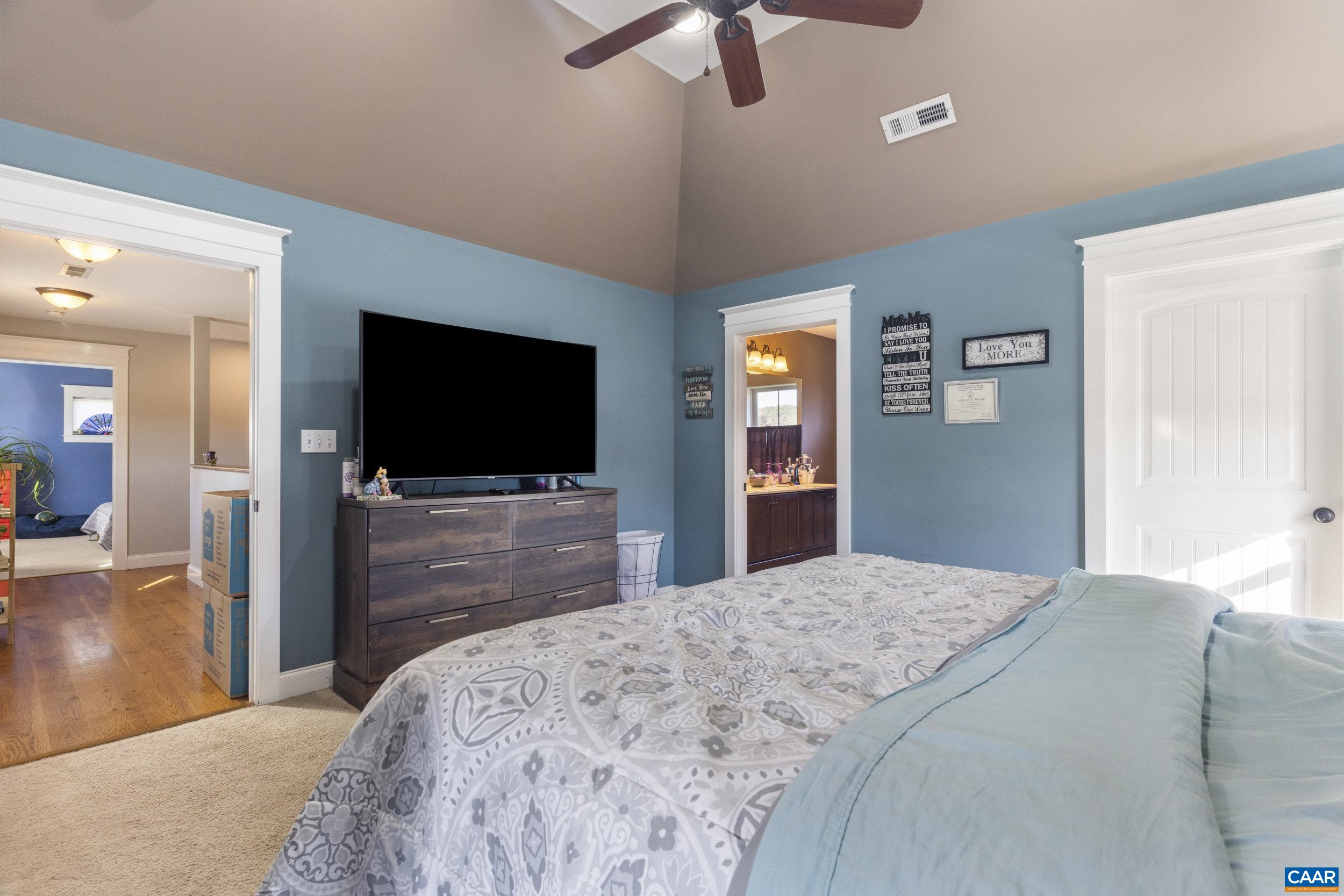 379 Crestview Drive Rustburg, VA 24588 - Photo 24 of 53 a bedroom with a bed and a flat screen tv