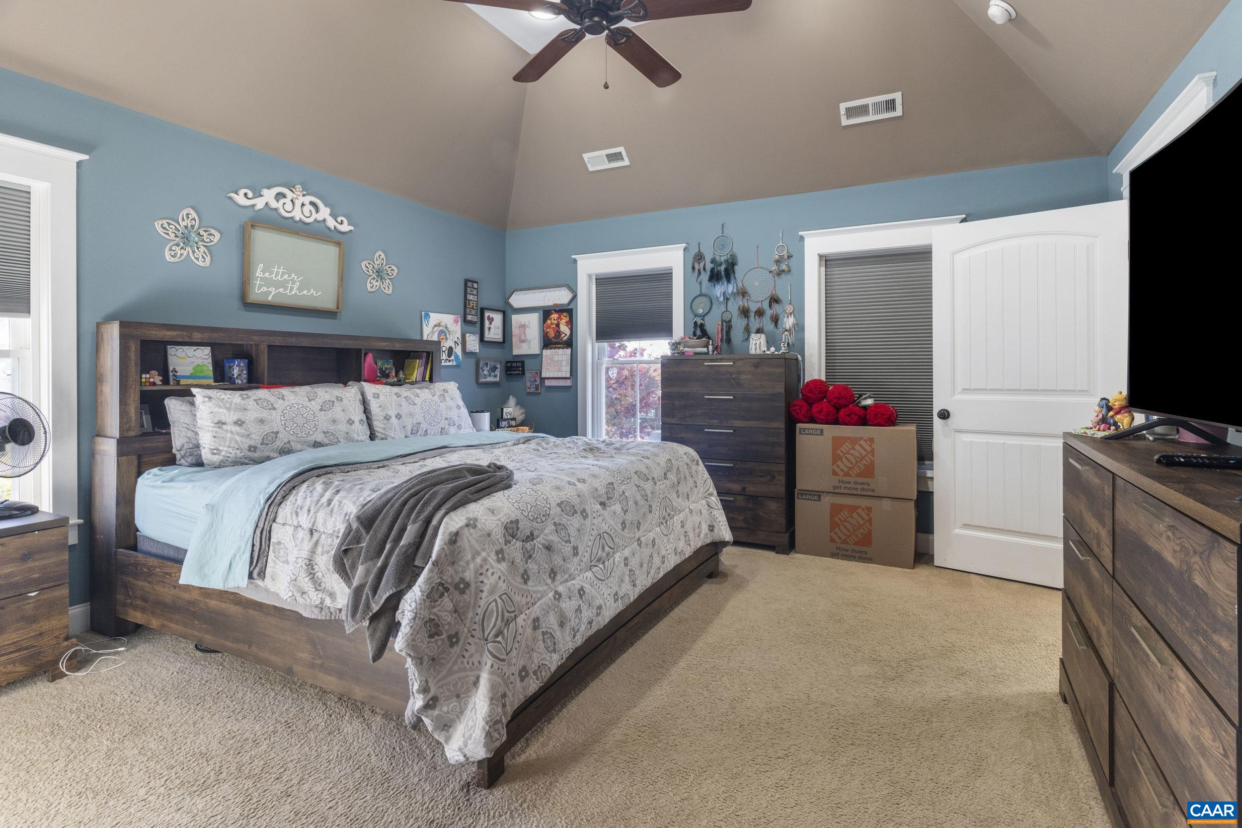 379 Crestview Drive Rustburg, VA 24588 - Photo 27 of 53 a bedroom with a bed and a flat screen tv