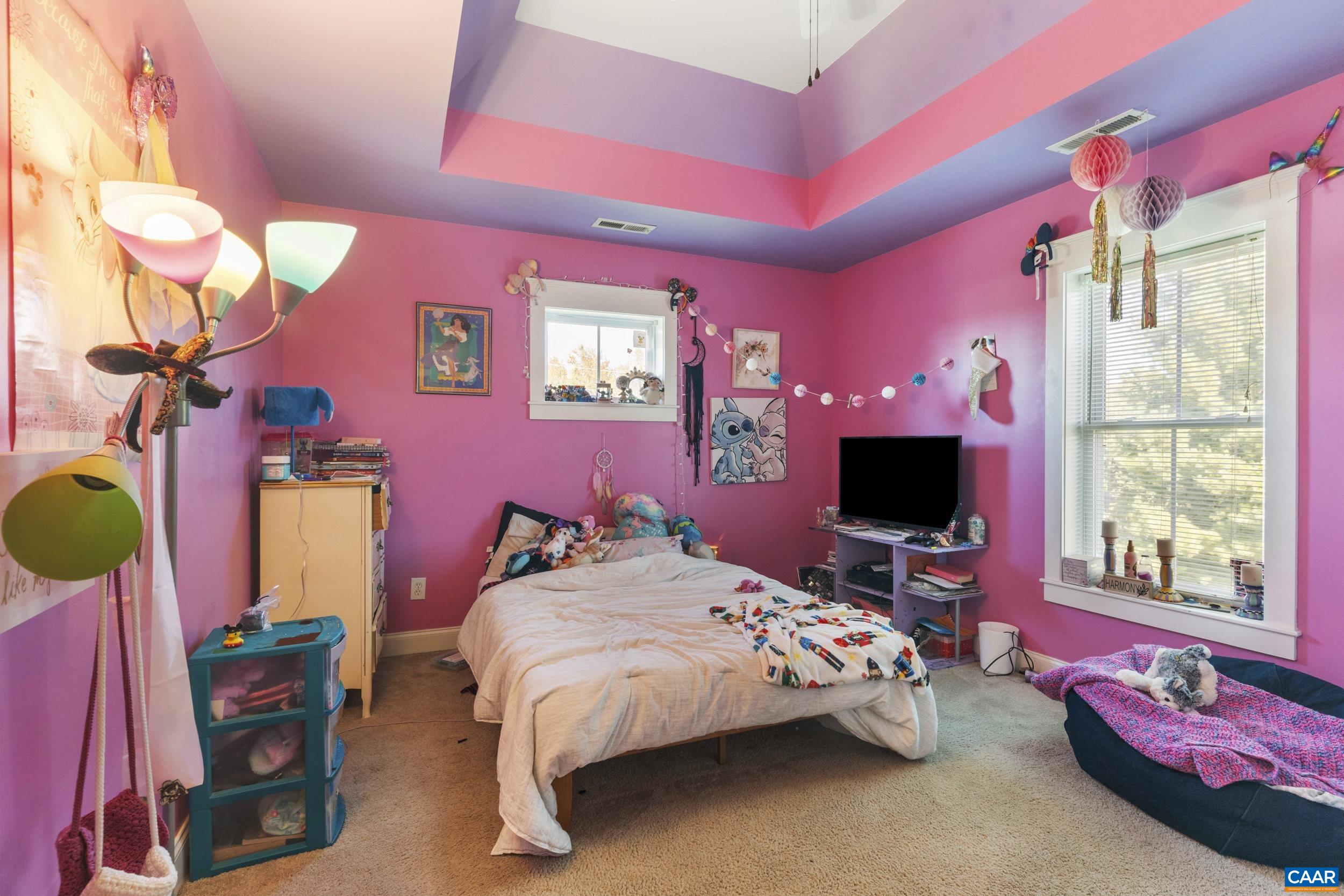 379 Crestview Drive Rustburg, VA 24588 - Photo 30 of 53 a bedroom with a bed and a flat screen tv