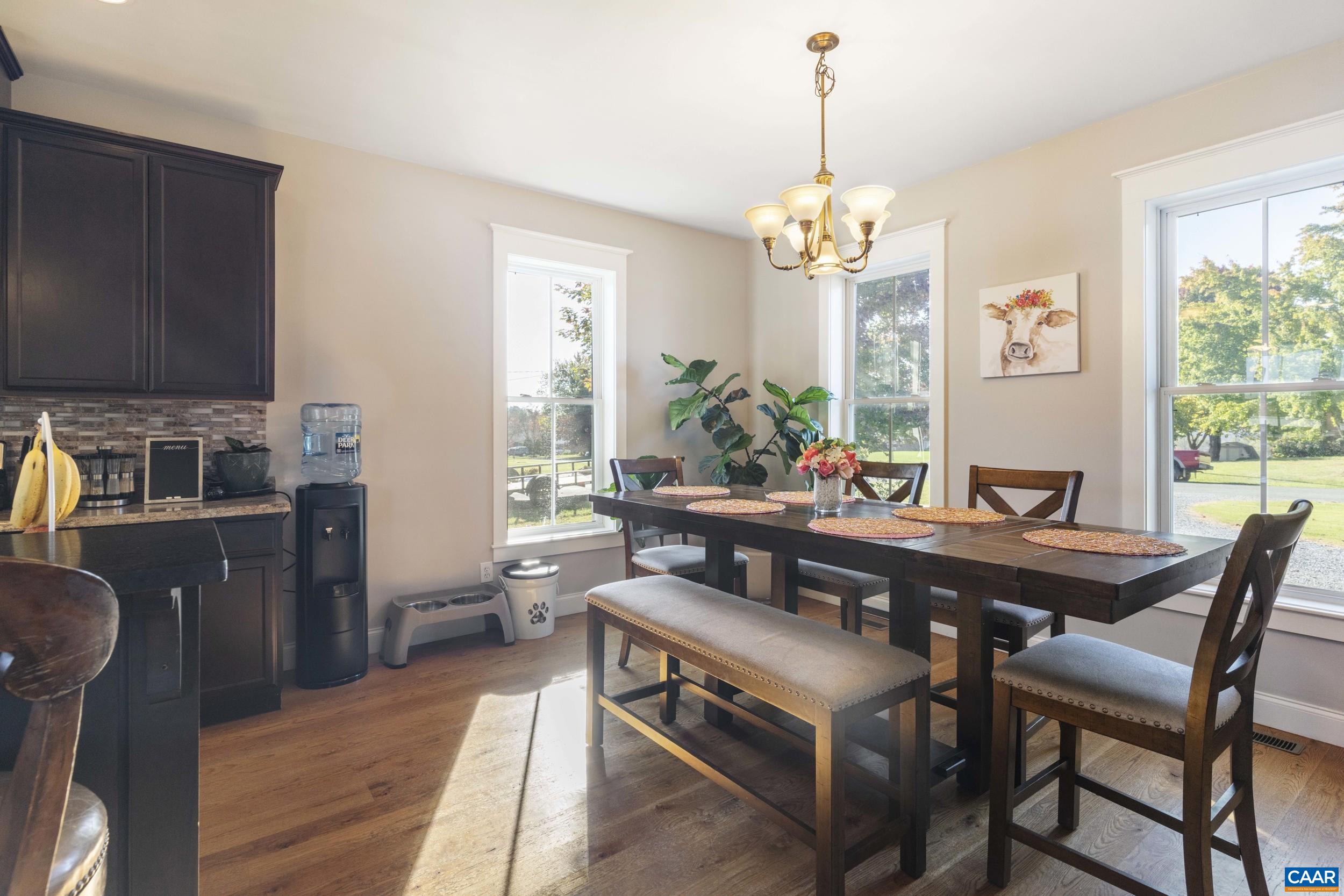 379 Crestview Drive Rustburg, VA 24588 - Photo 5 of 53 a view of a dining room with furniture window and wooden floor