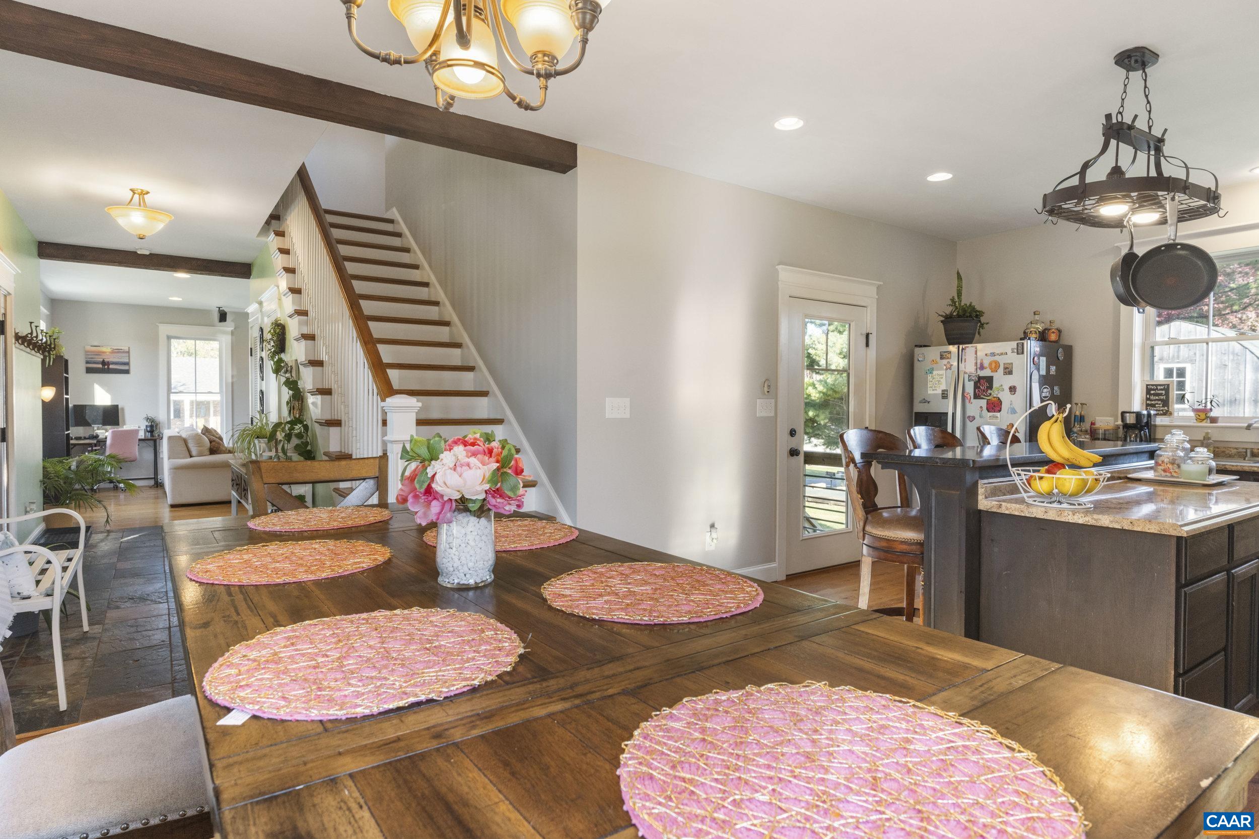 379 Crestview Drive Rustburg, VA 24588 - Photo 6 of 53 a kitchen with stainless steel appliances kitchen island granite countertop a dining table and chairs