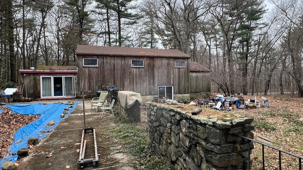 347 Main Street Boxford, MA 01921 - Photo 2 of 13 a view of a patio with table and chairs with wooden fence and plants