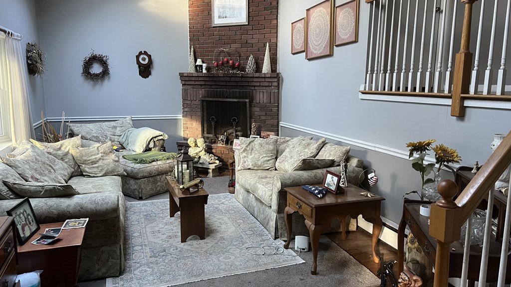 347 Main Street Boxford, MA 01921 - Photo 3 of 13 a living room with furniture and a fireplace