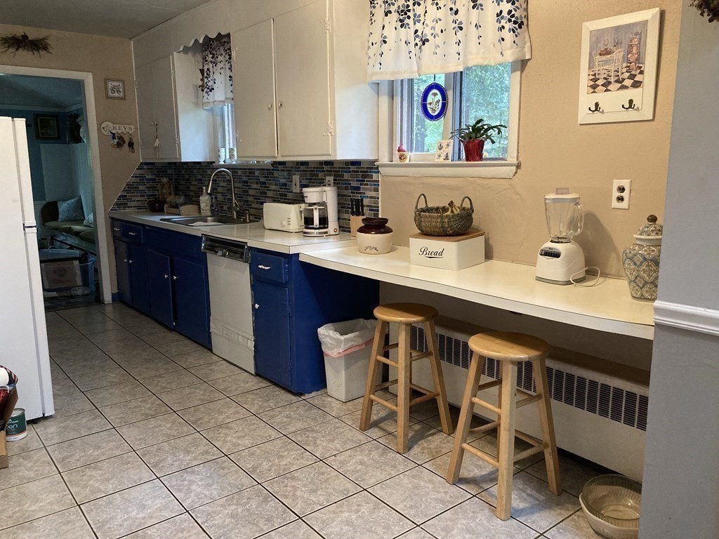 347 Main Street Boxford, MA 01921 - Photo 7 of 13 a kitchen with a sink and cabinets
