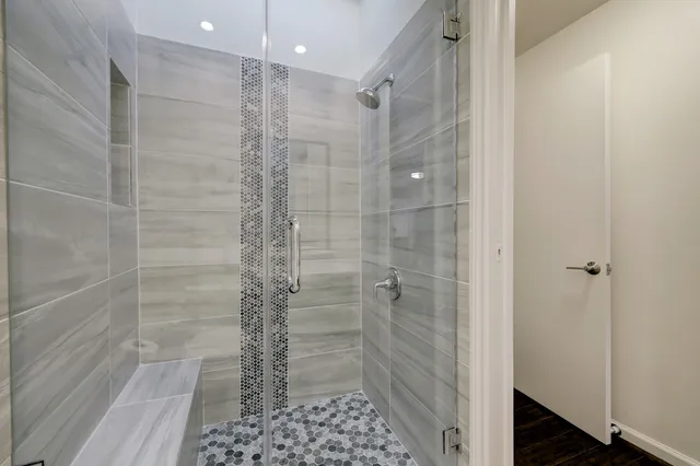 a bathroom with a shower and a toilet