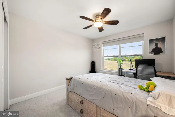 a bed room with a bed and a window