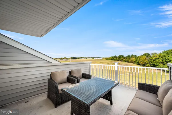 a balcony with furniture and city view