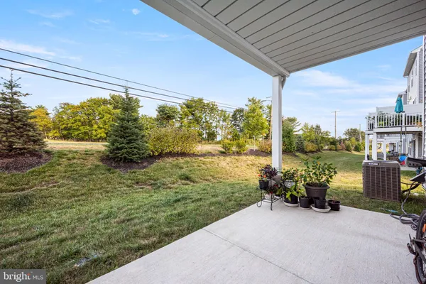 a backyard of a house with lots of green space