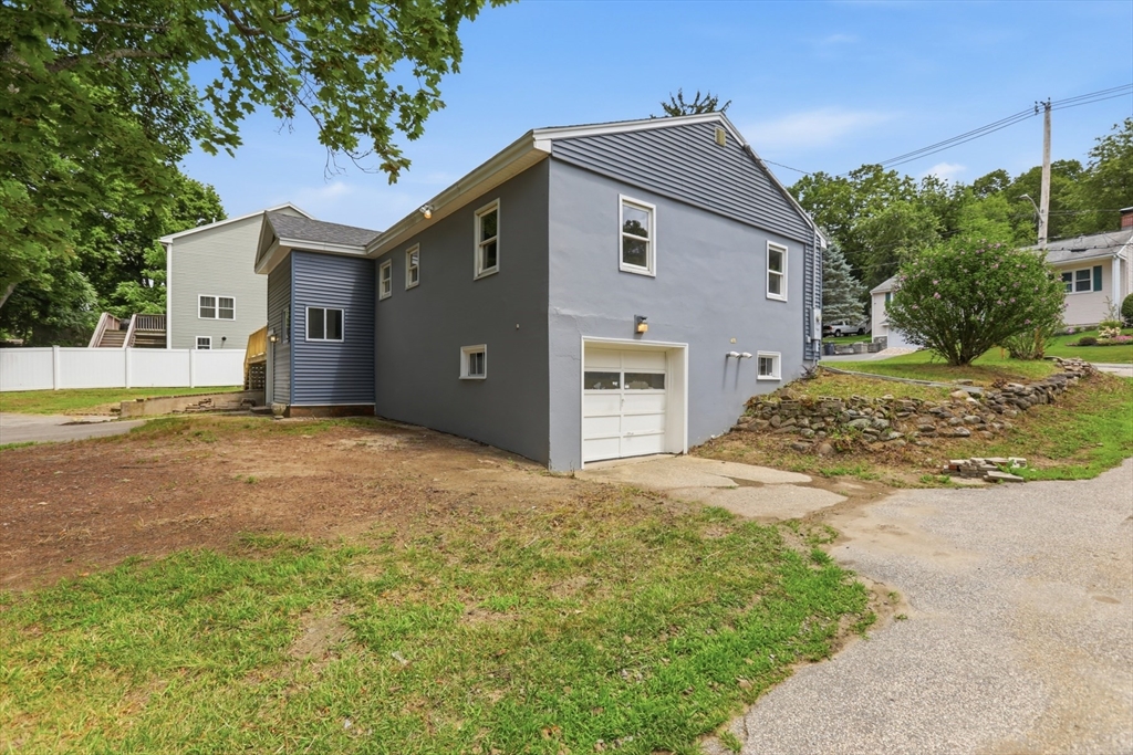 1007 Boston Road Haverhill, MA 01835 - Photo 23 of 32 a view of a house with a yard and garage