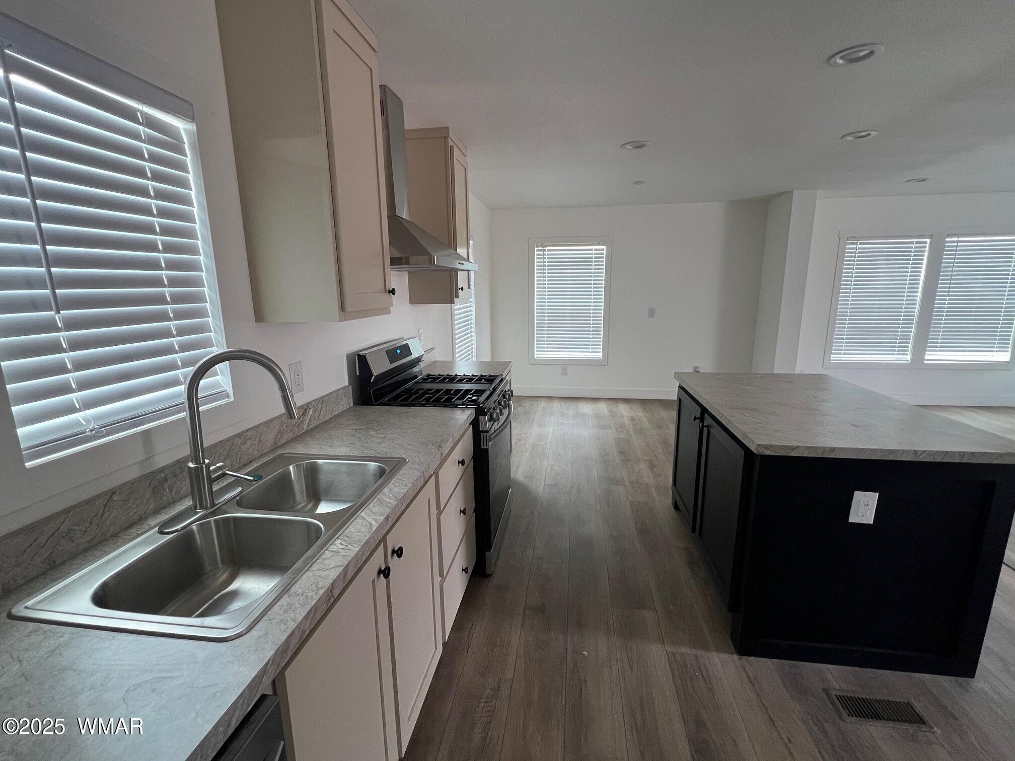 4129 Apache Road Snowflake, AZ 85937 - Photo 12 of 48 a kitchen with a sink stove and cabinets