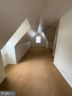 a view of an empty room with stairs