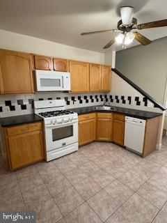 220 Ryers Avenue Cheltenham, PA 19012 - Photo 7 of 19 a kitchen with stainless steel appliances a stove a sink and a refrigerator